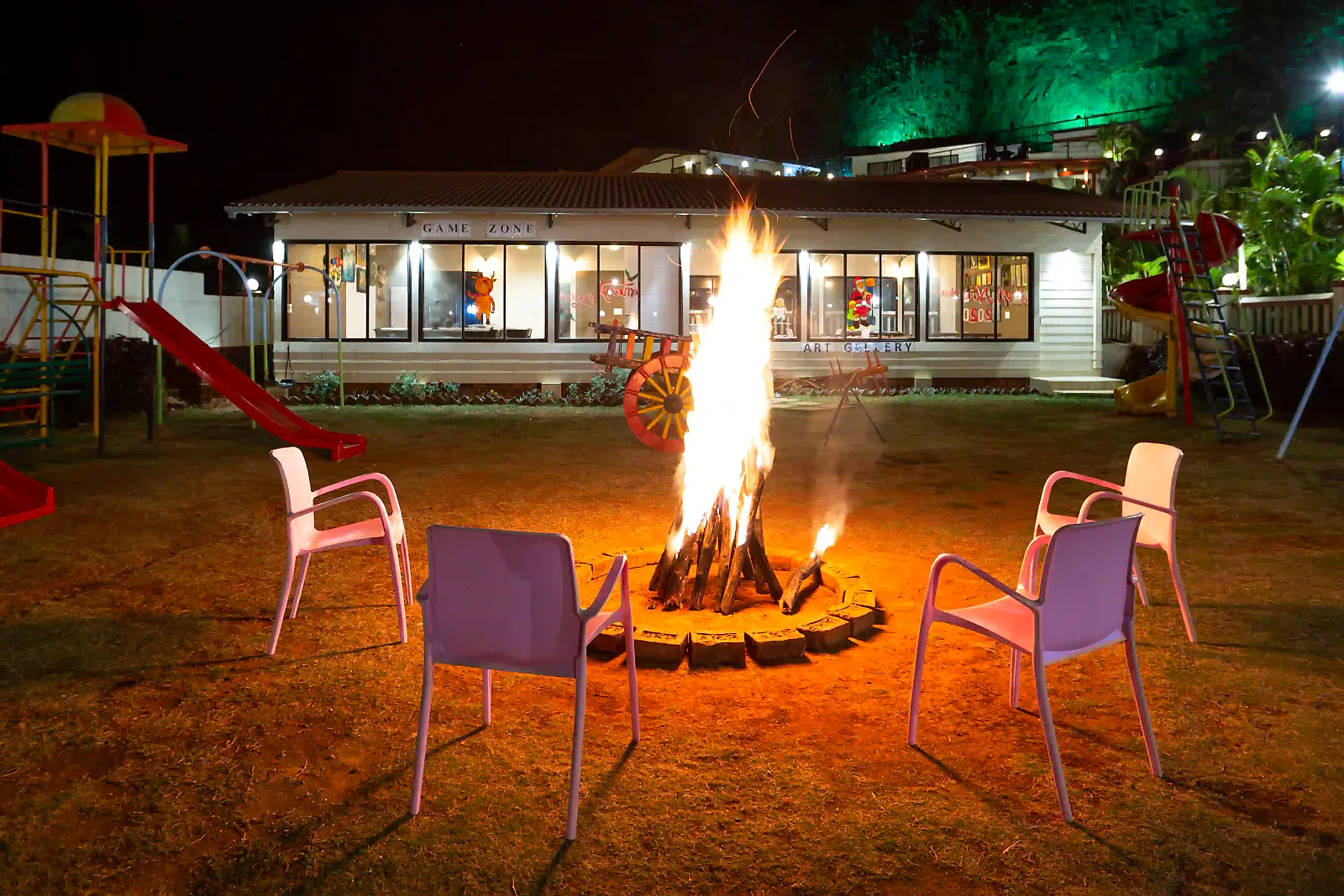 Bonfire dining at Cloud 9 Hills Resort with guests gathered around the fire