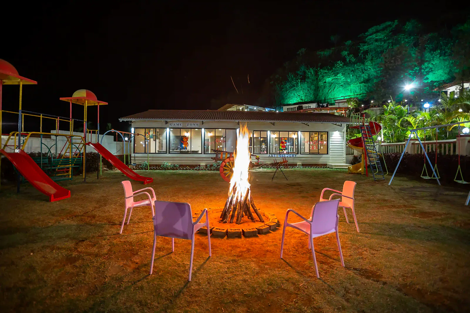 A bonfire on the lawn at night