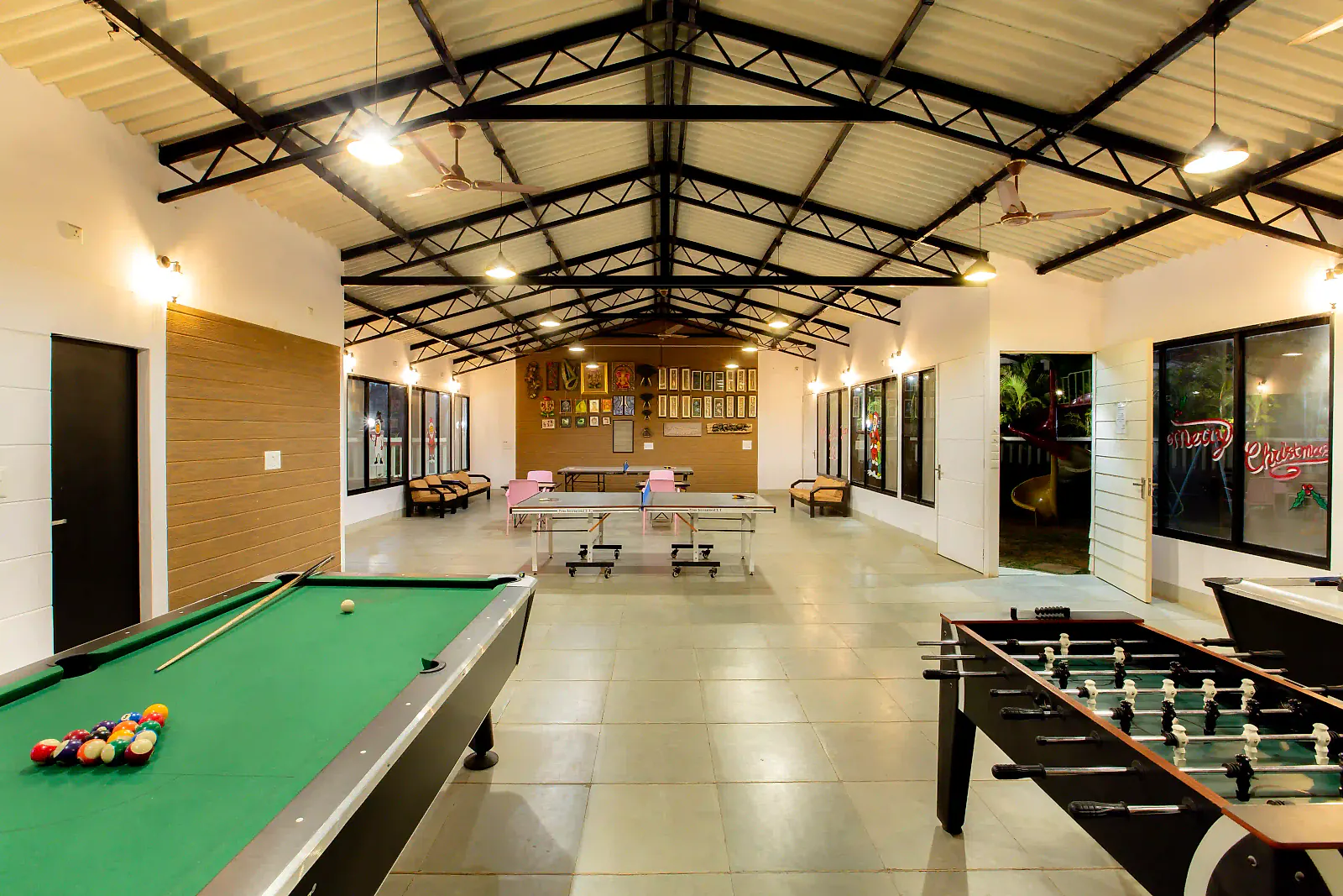 The indoor game zone with a pool table and foosball