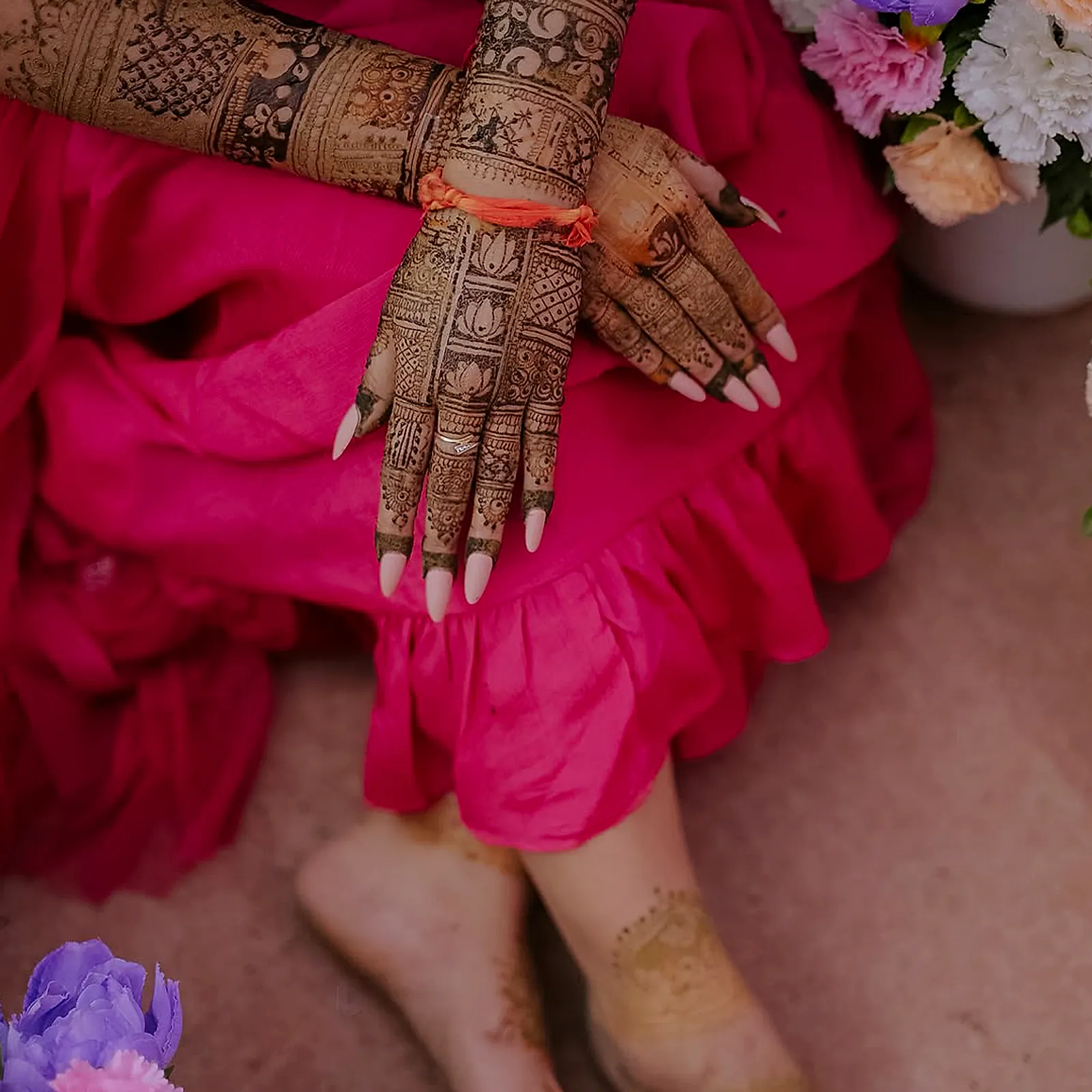 Close-up of the bride’s hennaed hands and feet