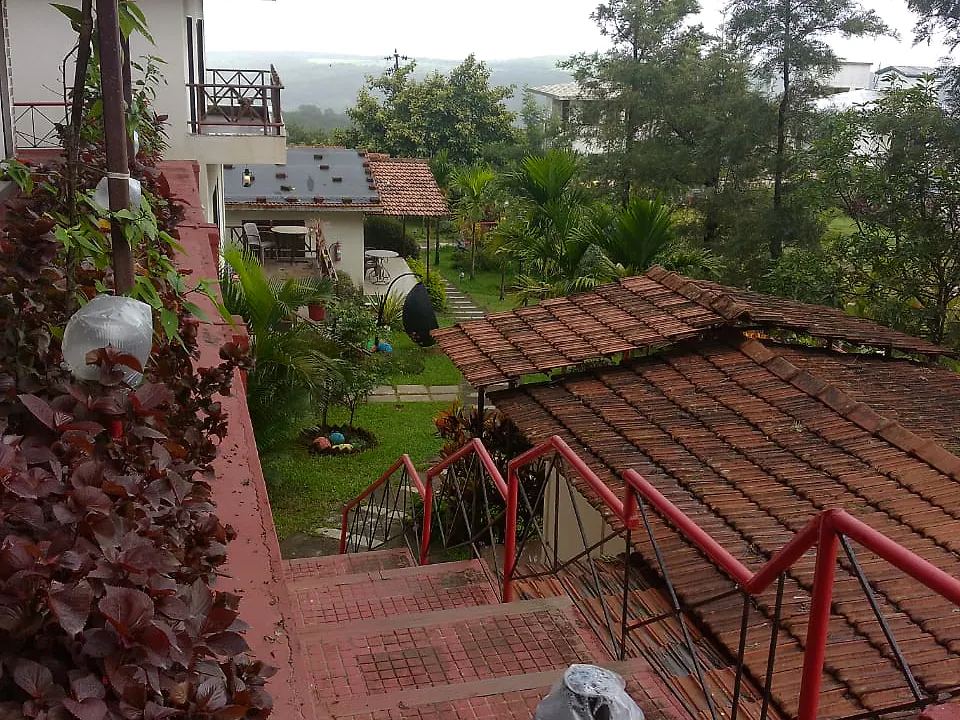 Steps down through the garden from the Hill Top Deluxe Cottages